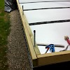 Close-up of framing, showing how threaded rods pass through notches routed into inner 2x4s around perimeter.