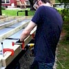 Screws going in around perimeter.