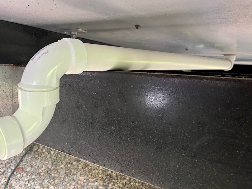 Greywater drain under tiny house
